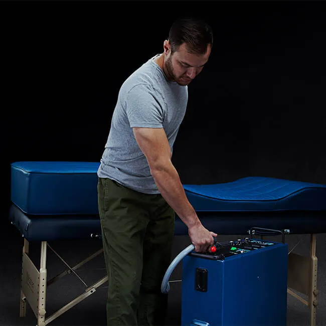 A man adjusting a PEMF machine