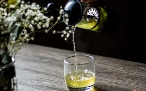 pouring green tea in a glass