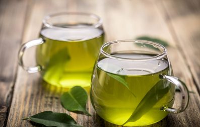 two cups in the table with green tea